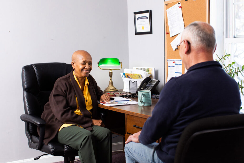 Man speaks to HCHC employee