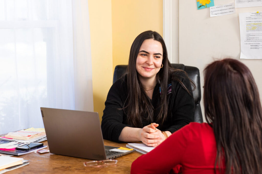 Woman speaks to HCHC employee